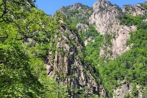 Steel footbridge below granite spires in Cheonbuldong Valley, Seoraksan